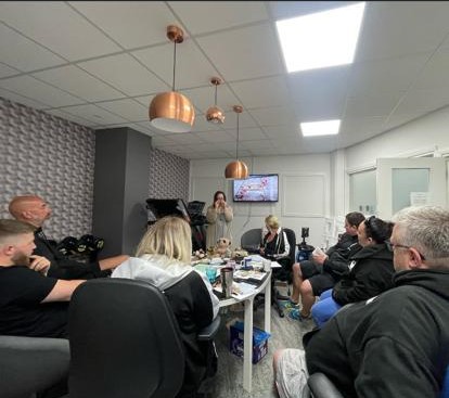 Meeting room with people watching presentation